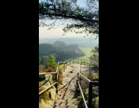 Guy walks down stairs towards viewing platform 