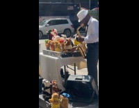 Man playing saxophone with dancing stuffed animals