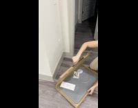 Lady Sets Up Quick Dry Dog Mat 