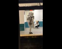 Person with tin foil robot costume