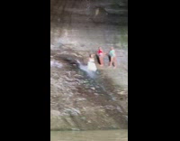 Woman white dress wet waterfalls photo shoot