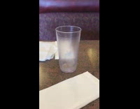 Empty glass moves on the restaurant table