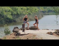 Two girls dance black shirt platform lake