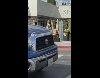 guy outside table stands on chair