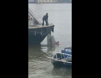 Guy jumps into water from a ferry 
