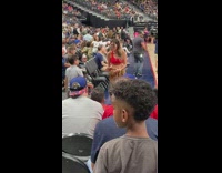 Bossy chick takes photo at basketball game 