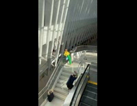 Girl leans on rail takes picture