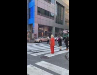 Guy trump costume mask orange shirt crosswalk