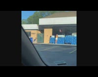 Yellow shirt girl blue water bottle packs store