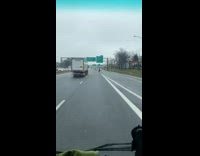Guy rides onewheel down highway with cars 