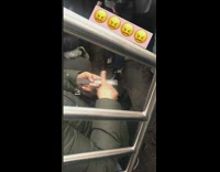 Woman files her index finger with nail filer on subway train