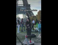 Ring light circles girl dancing by Eiffel Tower 