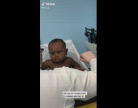 Baby boy gives doctor a dirty look