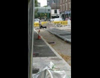 Black shirt guy poses construction site flash 