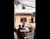 People Laugh at Stuffed Toy on Pajamas Over Window