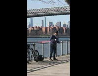 Black beanie guy pink resistance band park 