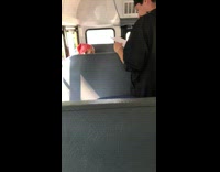 Guy blue bandana pops up out of bus seat and sings to blue face song