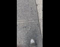 Collab WINY - Man walks with barefoot on the sidewalk