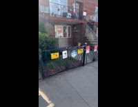 House fence full of no parking signs