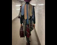 Man wear lots of necktie subway stairs