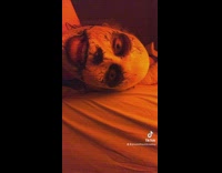 Clown tucks woman into bed 