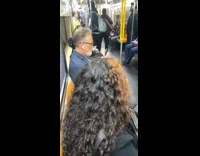 Blue blazer films girl on train