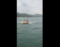Two girls yellow float bump into boat 