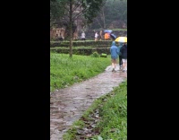 Two people tiktok dance at rainy temple