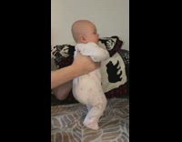 Baby girl wearing onesie buss it challenge 