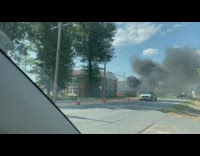 Car parked on fire big black smoke