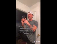 Guy grey shirt white hat looking on phone 