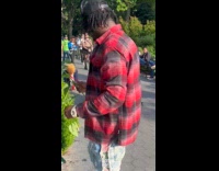 Woman on mobility scooter protest at park