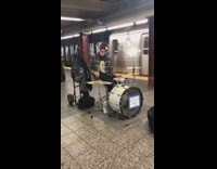 Guy maroon red beanie drums