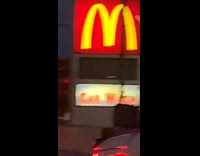 Car wash sign under mcdonalds sign 