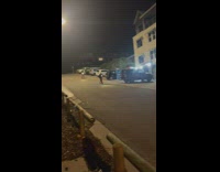 Person rides scooter down hill falls