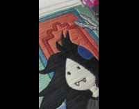 Time lapse of stitches going into cartoon girl picture 