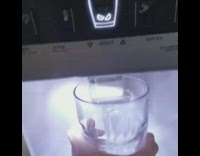 Guy dispenses ice refrigerator dog looks waits