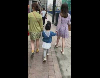Mom wears blue bracelet attached to kid 