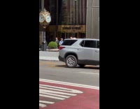 Donald Trump impersonator direct traffic on street