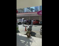 Black hat girl poses parking lot motorcycle 