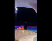 Woman red bikini poses at club pool