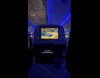 Passengers watch basketball game on plane ride