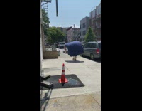 Collab winy - Guy fan blows air blue blanket sidewalk 