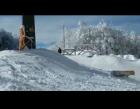 Snowboarder falls down face first, slo-mo video