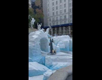Winter artwork has penguin sliding down ice