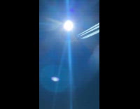 Airplane flies above filmer with smoke trail