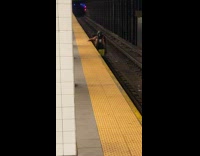 Collab Subway Creatures - Homeless man in hoodie jacket stand on train tracks