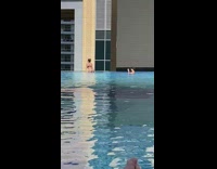 Woman black bikini thong show butt pool
