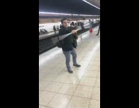 guy in black jacket dancing with crutch 