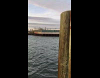 Guy red white buoy swims river water 